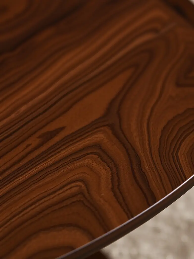 A detailed shot of the Solid Walnut Dining Table, highlighting the rich grain and smooth finish of the premium walnut wood used in its construction.